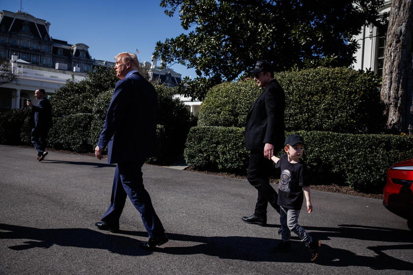 US President Trump views Tesla vehilces in front of the White House